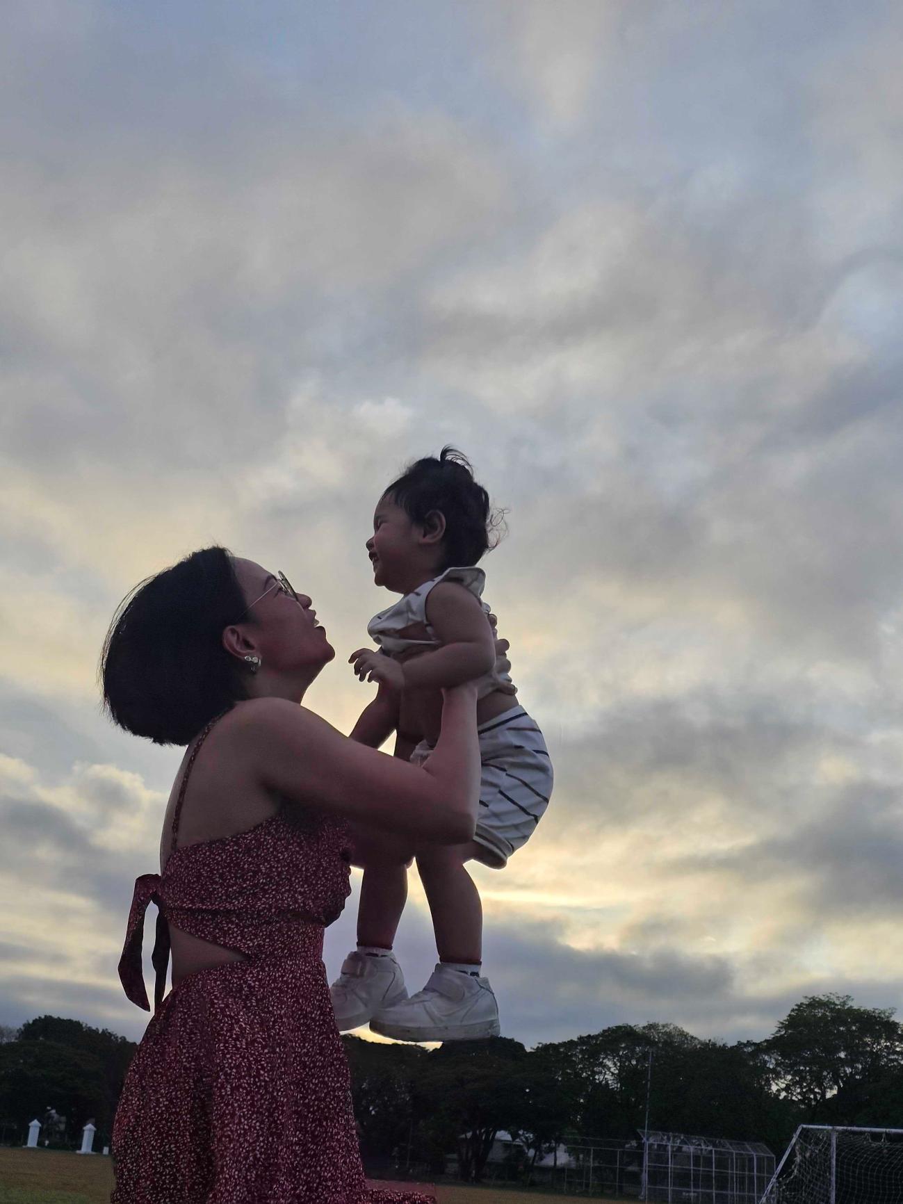 Michelle with her son at sunset