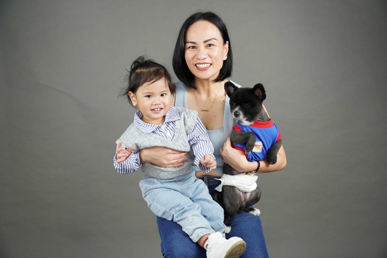 Michelle with her son and their dog